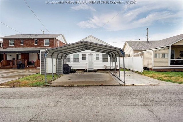 view of front facade with a carport