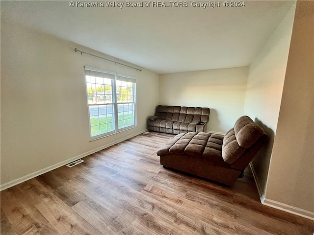 sitting room featuring light hardwood / wood-style floors