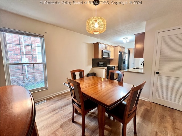 dining room featuring light hardwood / wood-style floors