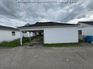 view of home's exterior with a carport