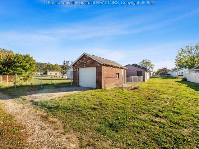 view of side of property with an outbuilding, a garage, and a lawn