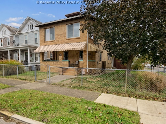 view of front facade with a porch and a front lawn