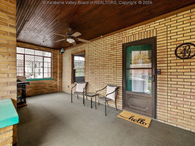 interior space with wooden ceiling and ceiling fan