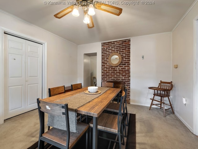 dining area featuring light carpet, crown molding, and ceiling fan