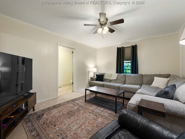 carpeted living room featuring crown molding and ceiling fan