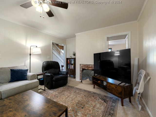 living room with carpet, ornamental molding, and ceiling fan