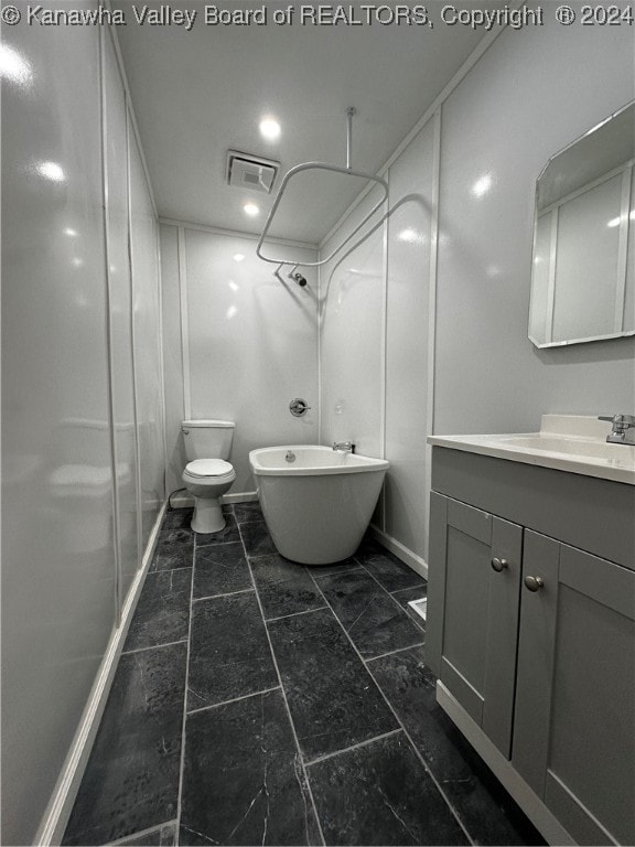 full bathroom featuring toilet, vanity, and separate shower and tub