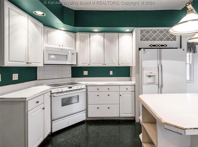 kitchen with light countertops, white cabinetry, and white appliances