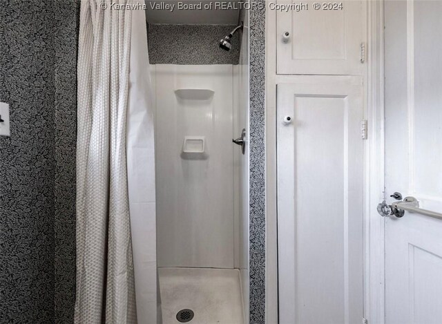 bathroom with a stall shower