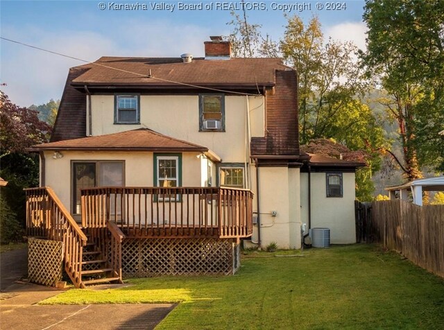 back of house featuring cooling unit, a chimney, fence, a deck, and stucco siding