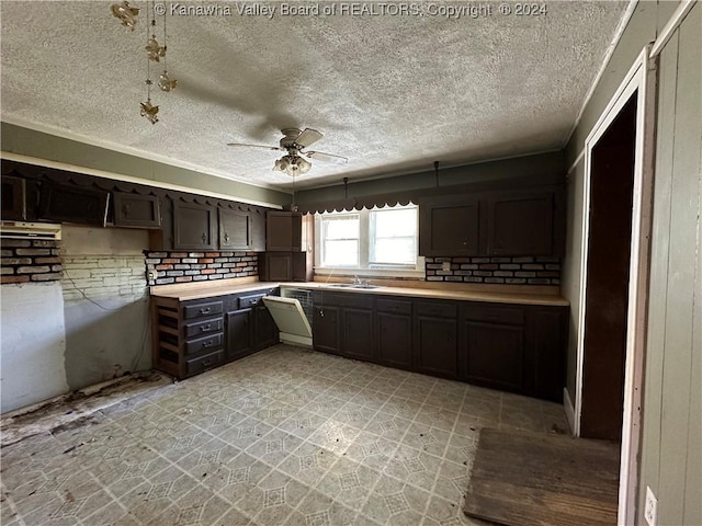 3962 39th St E, Nitro, WV 25143 - kitchen featuring a ceiling fan, a sink, light countertops, a textured ceiling, and light flooring