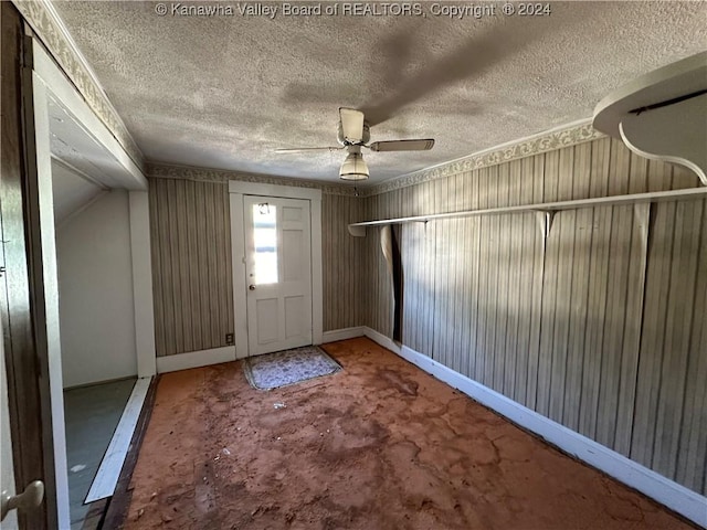 3962 39th St E, Nitro, WV 25143 - entrance foyer with a textured ceiling, concrete floors, and a ceiling fan