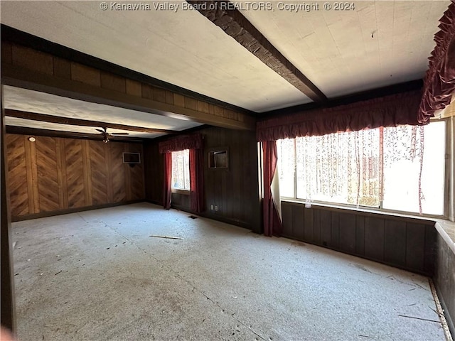 3962 39th St E, Nitro, WV 25143 - unfurnished living room with wood walls and beamed ceiling