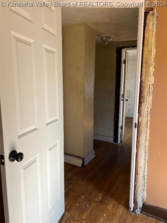 corridor featuring dark wood-type flooring