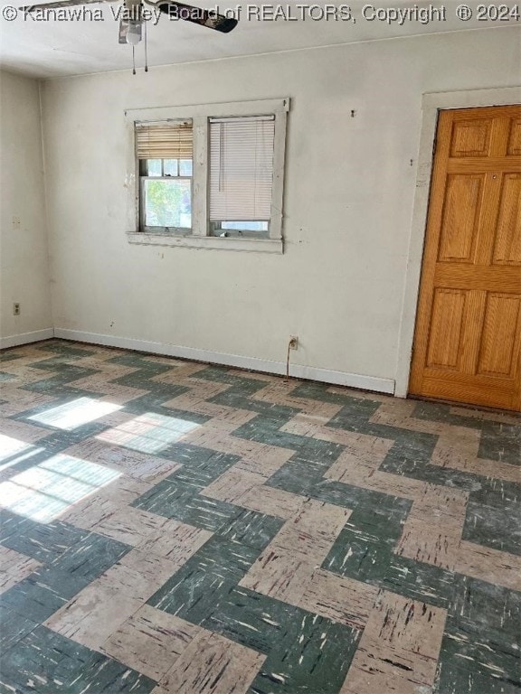 spare room featuring ceiling fan