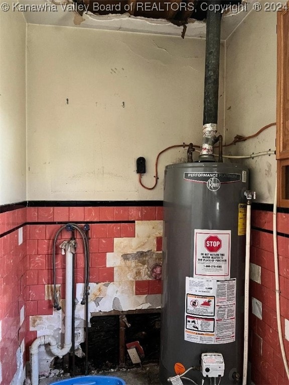 utility room featuring gas water heater