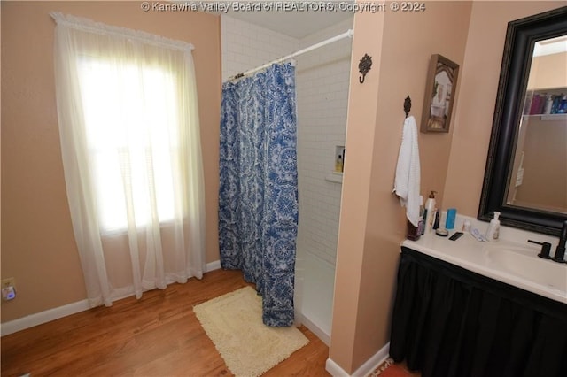 bathroom featuring vanity and wood-type flooring