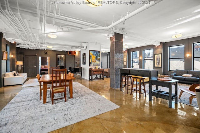 dining room with concrete flooring