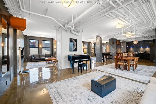 living room with concrete flooring