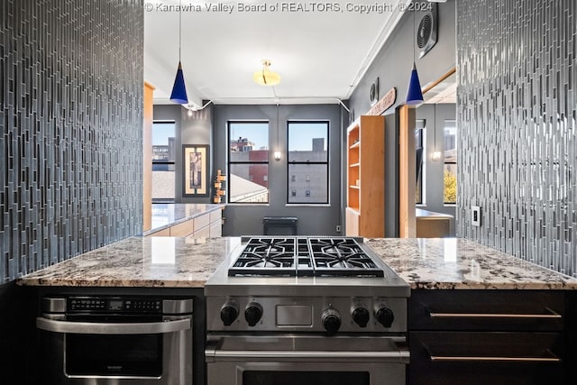 kitchen featuring decorative backsplash, appliances with stainless steel finishes, ornamental molding, and decorative light fixtures