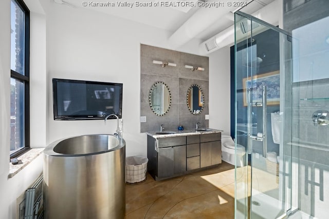 bathroom with vanity, concrete floors, and an enclosed shower