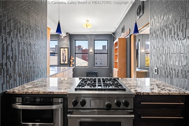 109 Capitol St Unit 400, Charleston, WV 25301 - kitchen featuring light stone countertops and stainless steel appliances