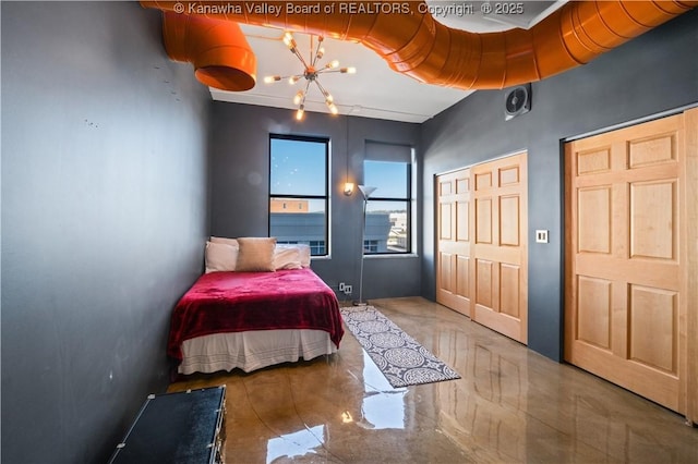 109 Capitol St Unit 400, Charleston, WV 25301 - bedroom featuring a notable chandelier