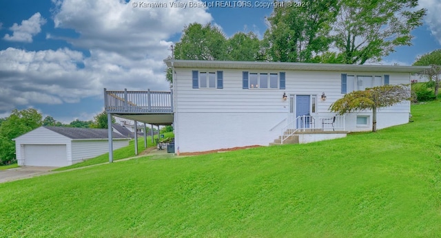 raised ranch with a front yard, an outbuilding, and a garage