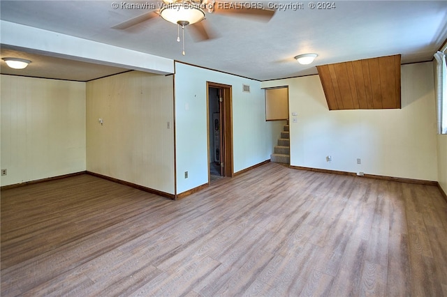 spare room featuring light hardwood / wood-style floors and ceiling fan