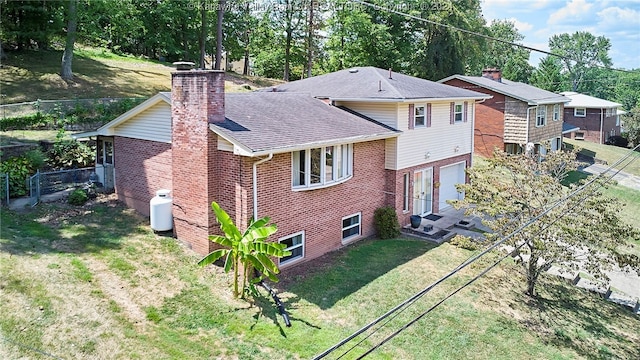 rear view of house with a yard