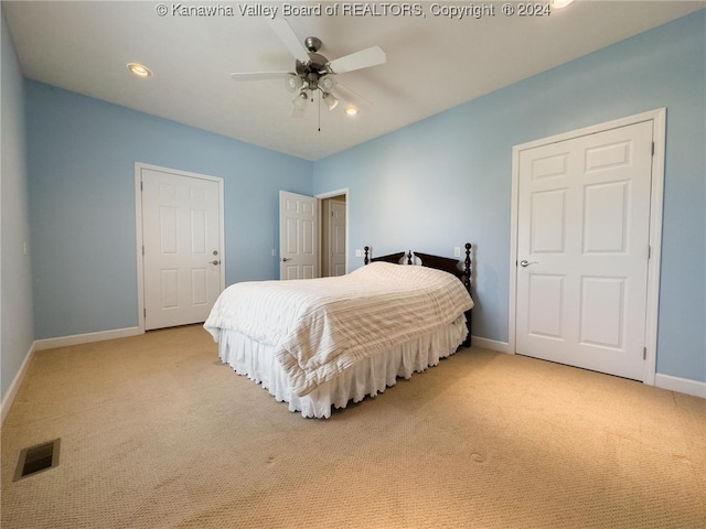 carpeted bedroom with ceiling fan