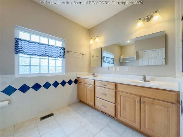 bathroom with vanity, tile walls, and tile patterned flooring