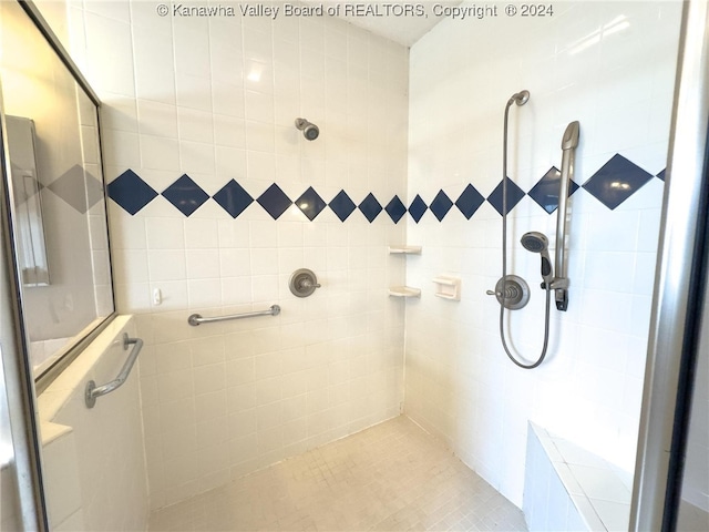 bathroom with a tile shower