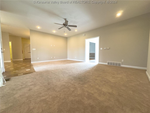 empty room featuring carpet floors and ceiling fan