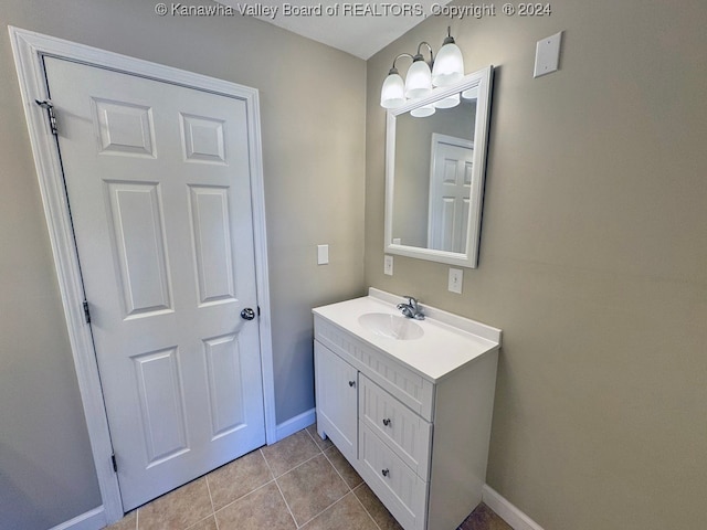 bathroom with vanity and tile patterned flooring