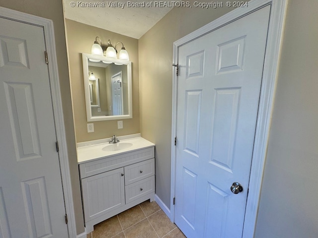 bathroom with vanity and tile patterned floors