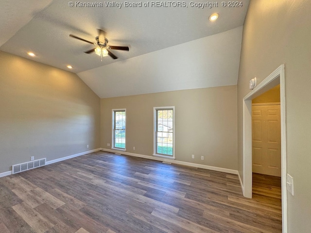 interior space featuring vaulted ceiling, ceiling fan, and dark hardwood / wood-style flooring