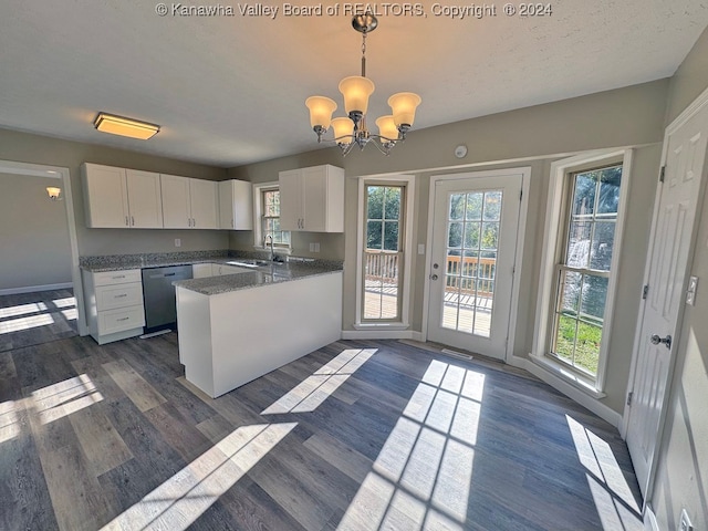 kitchen with dishwasher, white cabinets, kitchen peninsula, and decorative light fixtures