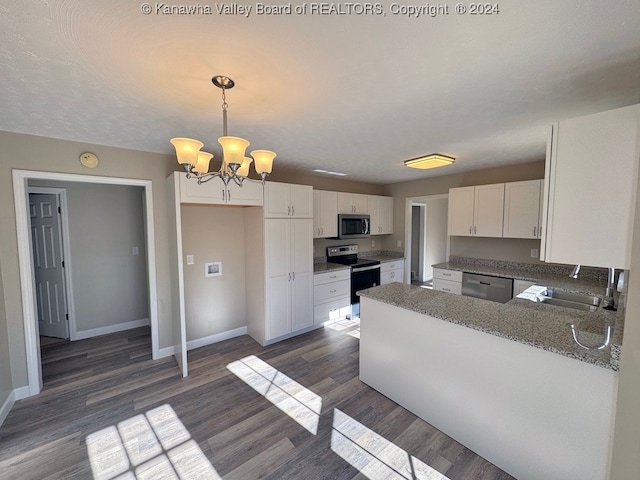 kitchen featuring white cabinets, dark hardwood / wood-style flooring, sink, decorative light fixtures, and stainless steel appliances