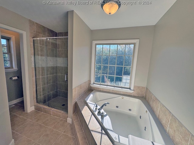 bathroom featuring tile patterned floors and shower with separate bathtub