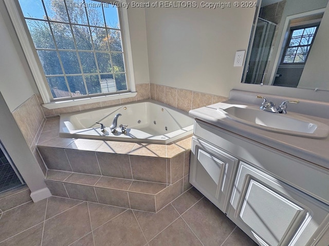 bathroom with vanity, tile patterned floors, and independent shower and bath