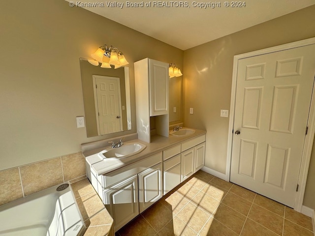 bathroom with vanity, a notable chandelier, and tile patterned floors