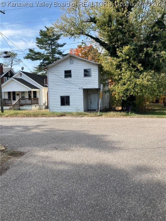 view of side of property featuring a porch