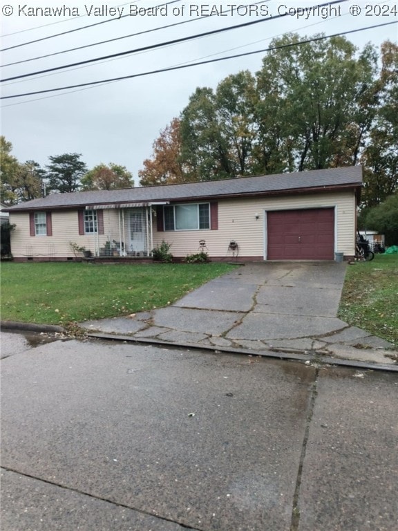 277 Wood St, Davisville, WV 26142 - single story home with an attached garage, concrete driveway, and a front yard