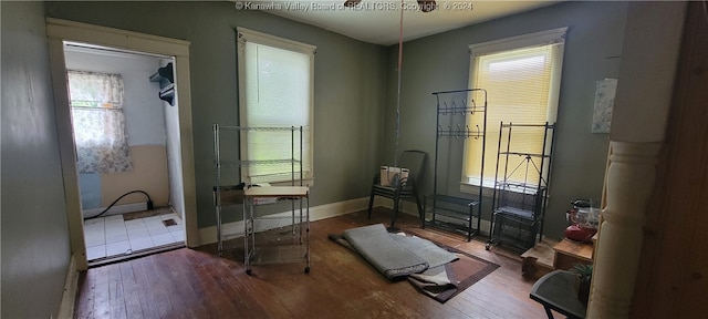 workout room with hardwood / wood-style floors