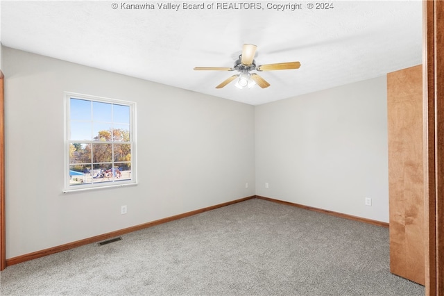 unfurnished room featuring carpet floors and ceiling fan