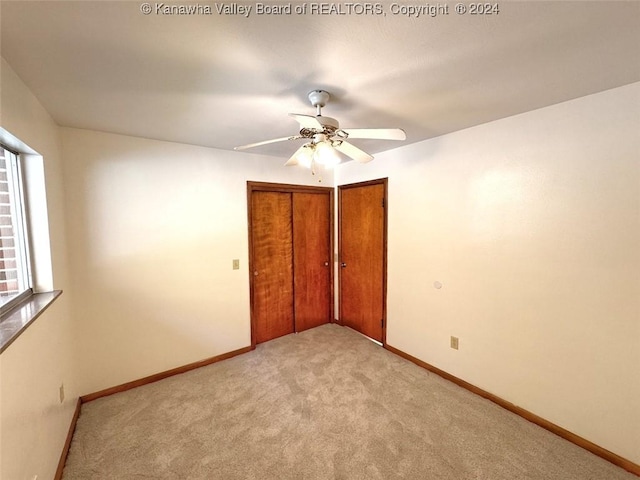 1526 Trace Fork Rd, South Charleston, WV 25309 - unfurnished bedroom with light carpet and ceiling fan