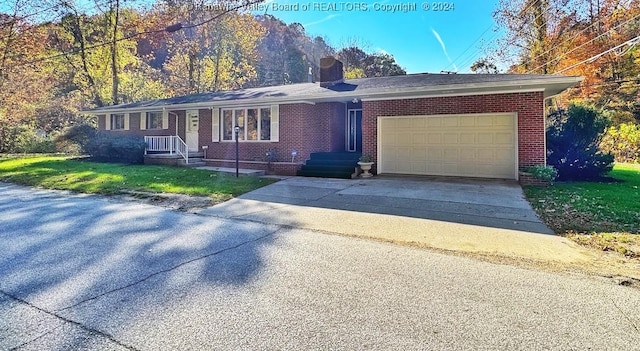 1526 Trace Fork Rd, South Charleston, WV 25309 - ranch-style house with a garage, concrete driveway, brick siding, a chimney, and a front yard