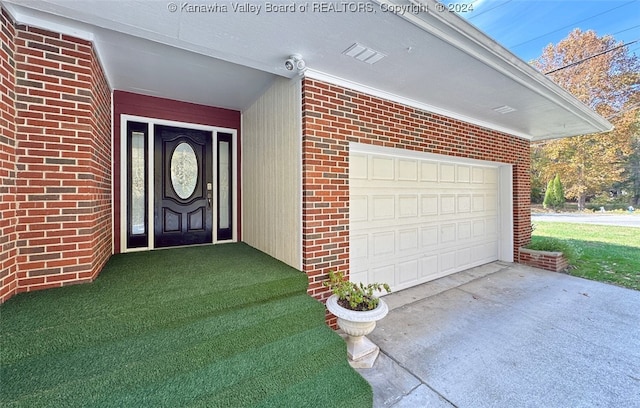 view of exterior entry featuring a garage