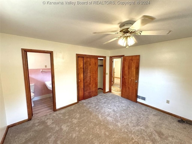 1526 Trace Fork Rd, South Charleston, WV 25309 - unfurnished bedroom featuring carpet flooring, a closet, ensuite bathroom, and ceiling fan